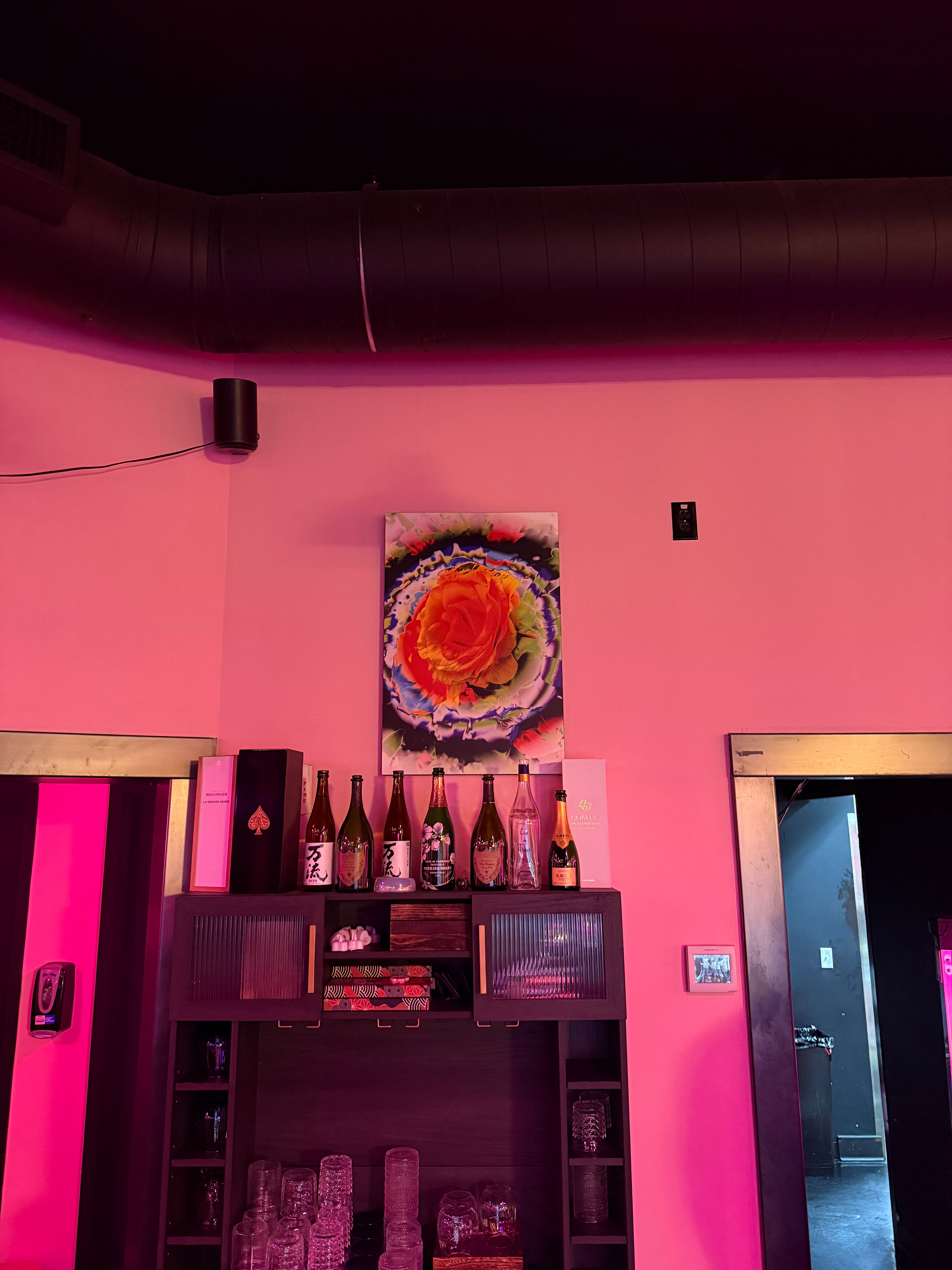 Rainbow Rose wood panel artwork by Offbeat displayed inside Champagne Poetry Portland